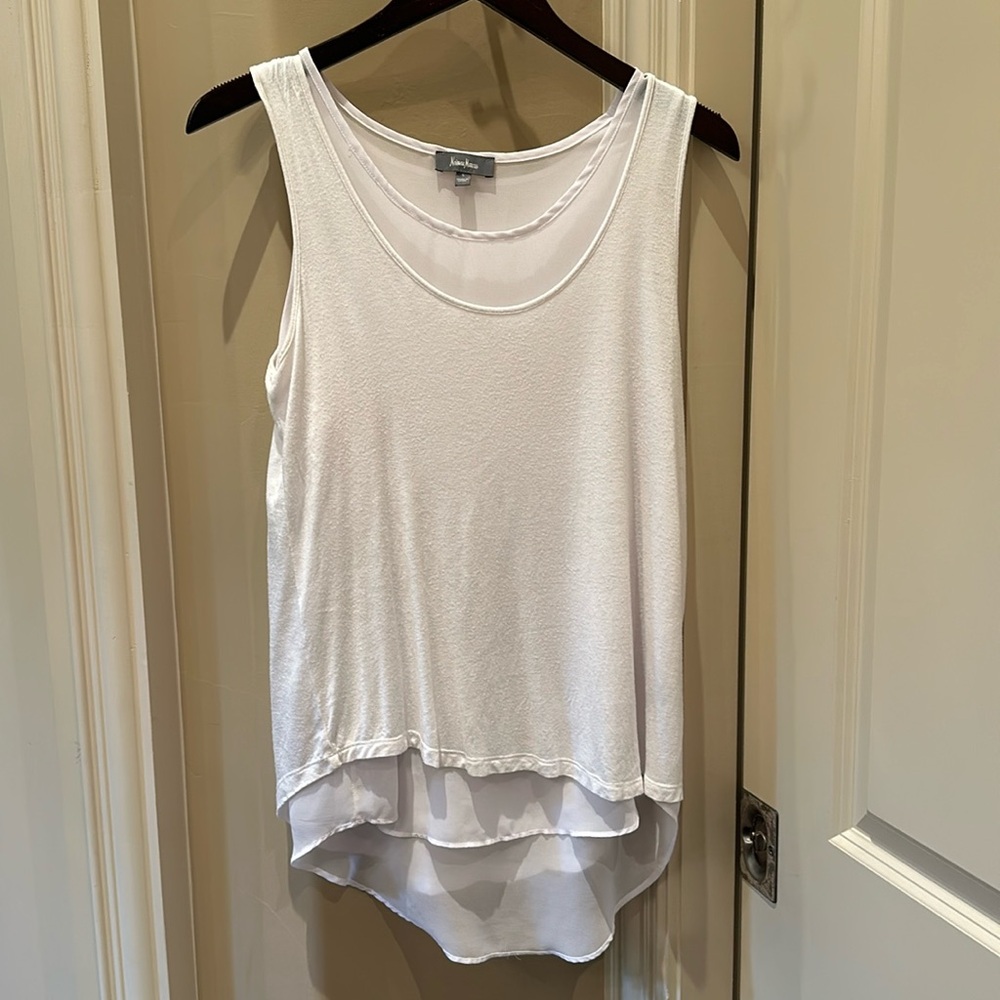 White tank top with a sheer under layer.